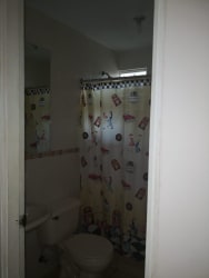 Bedroom with beige walls and tile floors at Arboledas Cluster Los Olivos La Chorrera