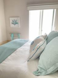 Infinity pool facing ocean among palm trees at Buenaventura Puntarena Panama