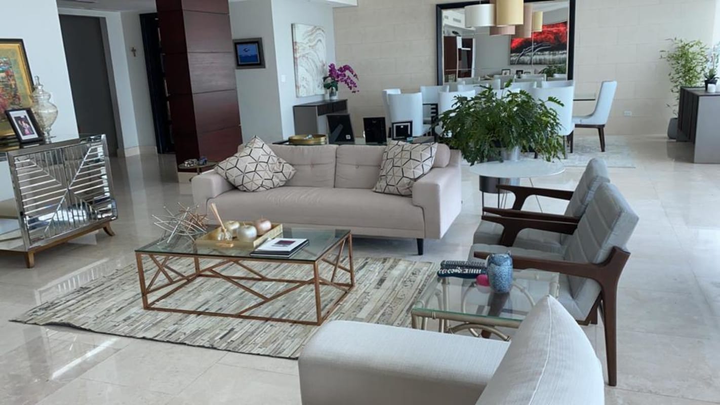 Open floor plan with elegant living and dining areas in PH Zeus, marble floors, contemporary decor