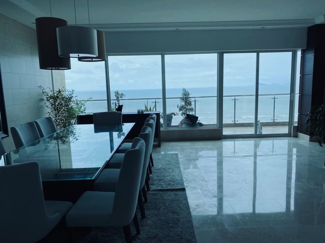Luxury master bedroom with ocean view, blue accent wall and modern lighting in PH Zeus Panama