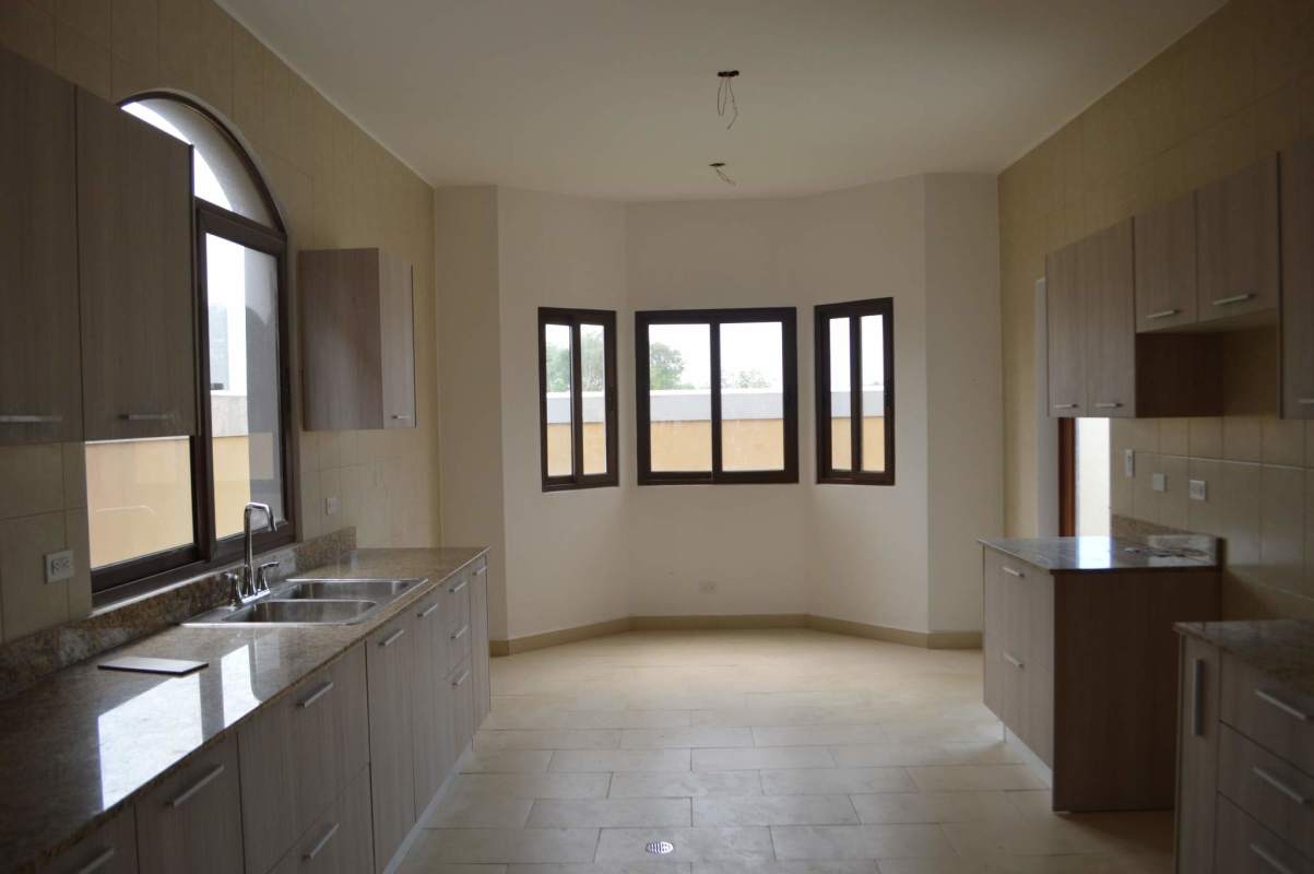 Interior staircase with stylish railing in new Mediterranean-style house El Doral Panama