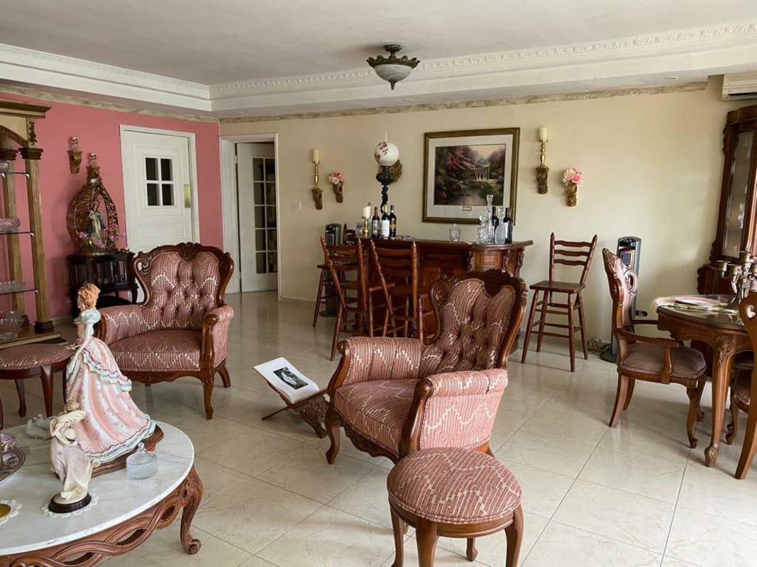 Classic style kitchen, stainless steel refrigerator, gas stove, black countertops in PH Ocean Club Panama