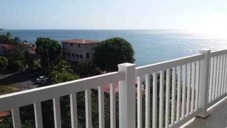 Fully furnished bedroom with mirrored closet doors, AC, ocean view window at PH Playa Corona Panama