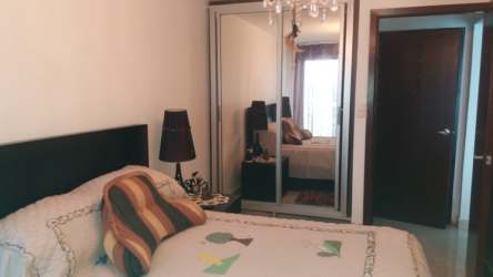 Bedroom with mirrored closet, chandelier lighting in beachfront condo PH Playa Corona San Carlos Panama