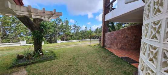 Covered patio area and garden lawn mountain villa Altos del María Panama