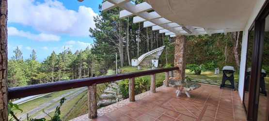Dining area large windows mountain views Altos del María Panama villa