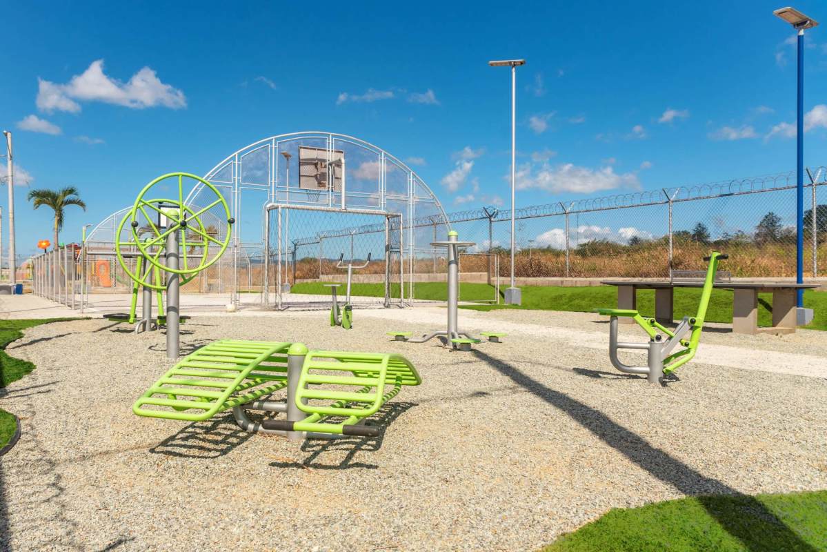 Recreational park area with outdoor gym and basketball facilities in gated community Pacora Panama