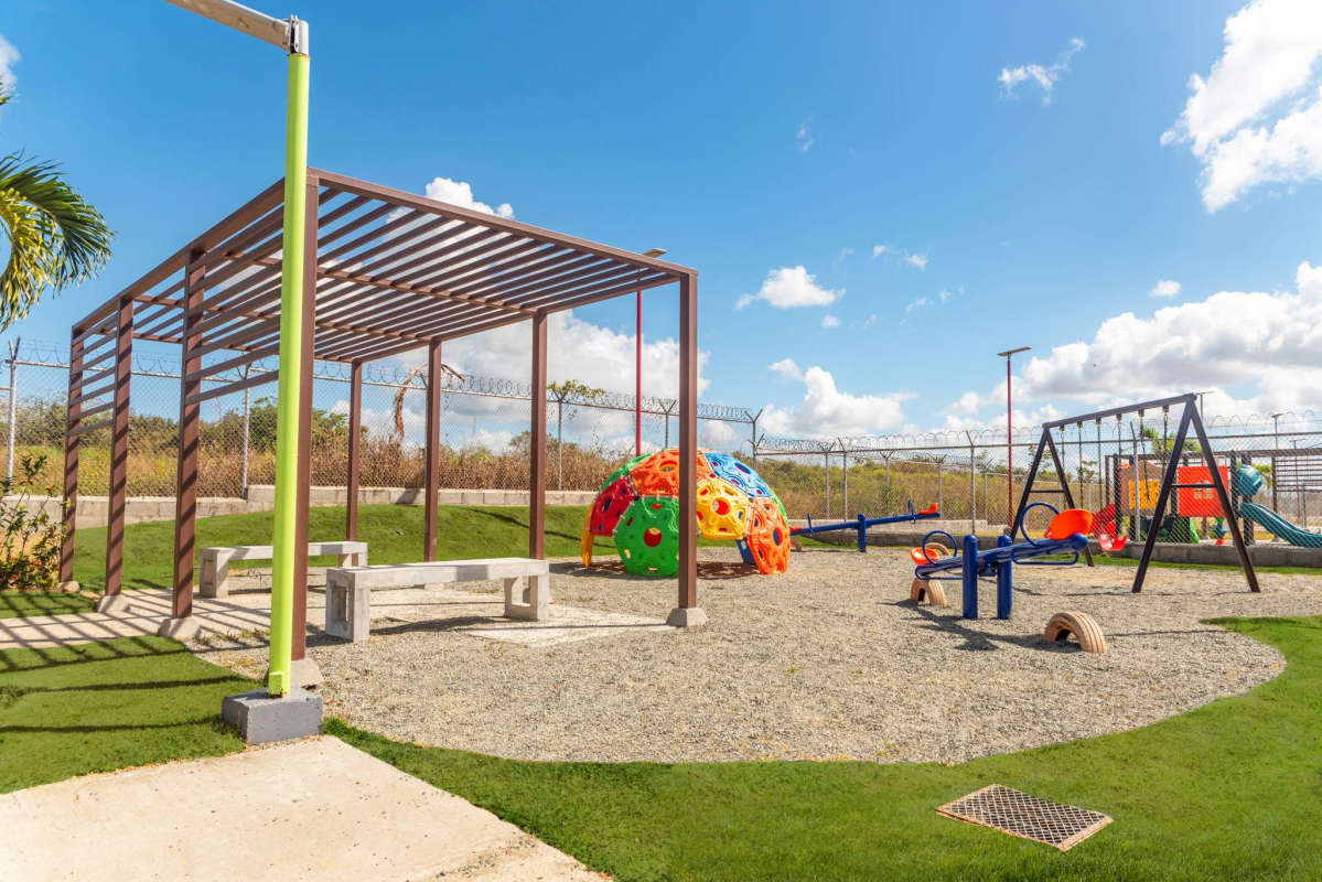 Colorful playground and shaded park area at Residencial Viñedo 2 Community Pacora
