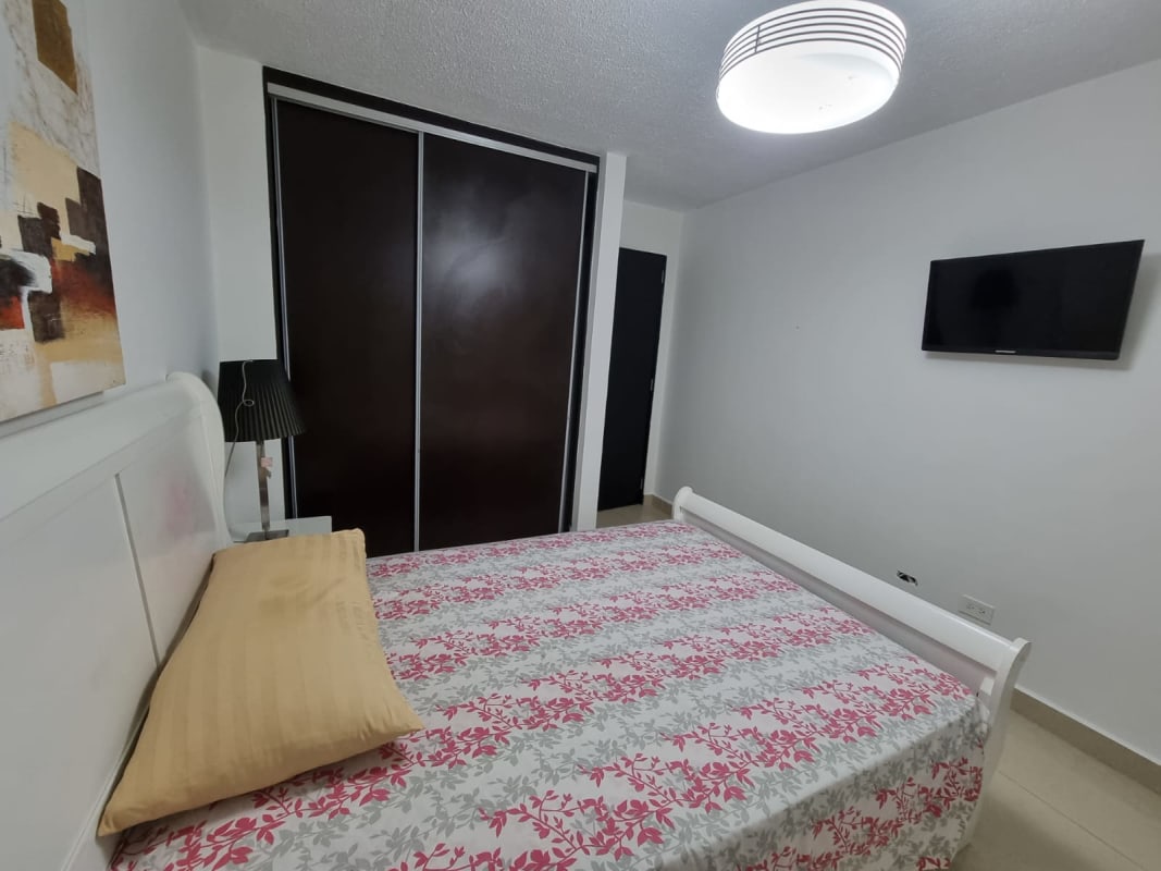 Modern bathroom with glass shower and ceramic sink in Altamira Gardens apartment Panama