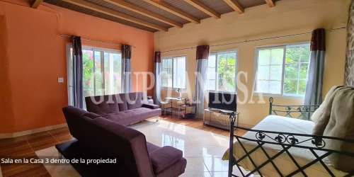 Bedroom with mountain views rustic ceiling and large window in Altos del María Panama