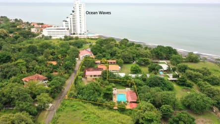 Front gated entrance with garden Malibu Beach Gorgona property for sale