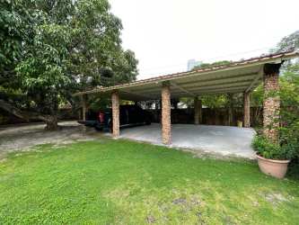 Aerial shot beach property Playa Gorgona near ocean with pool and guest houses