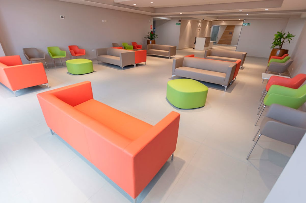 Town Center Costa del Este lobby and waiting area with colorful sofas natural light and modern design