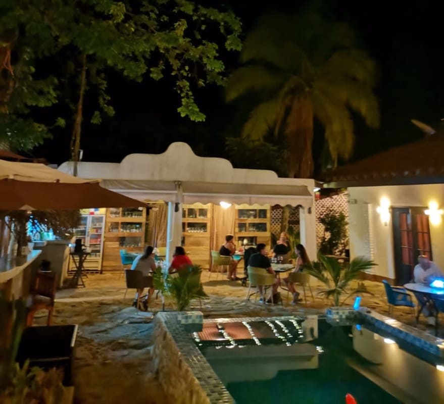 Outdoor patio lounge area with night lighting at boutique hotel Isla Contadora Panama