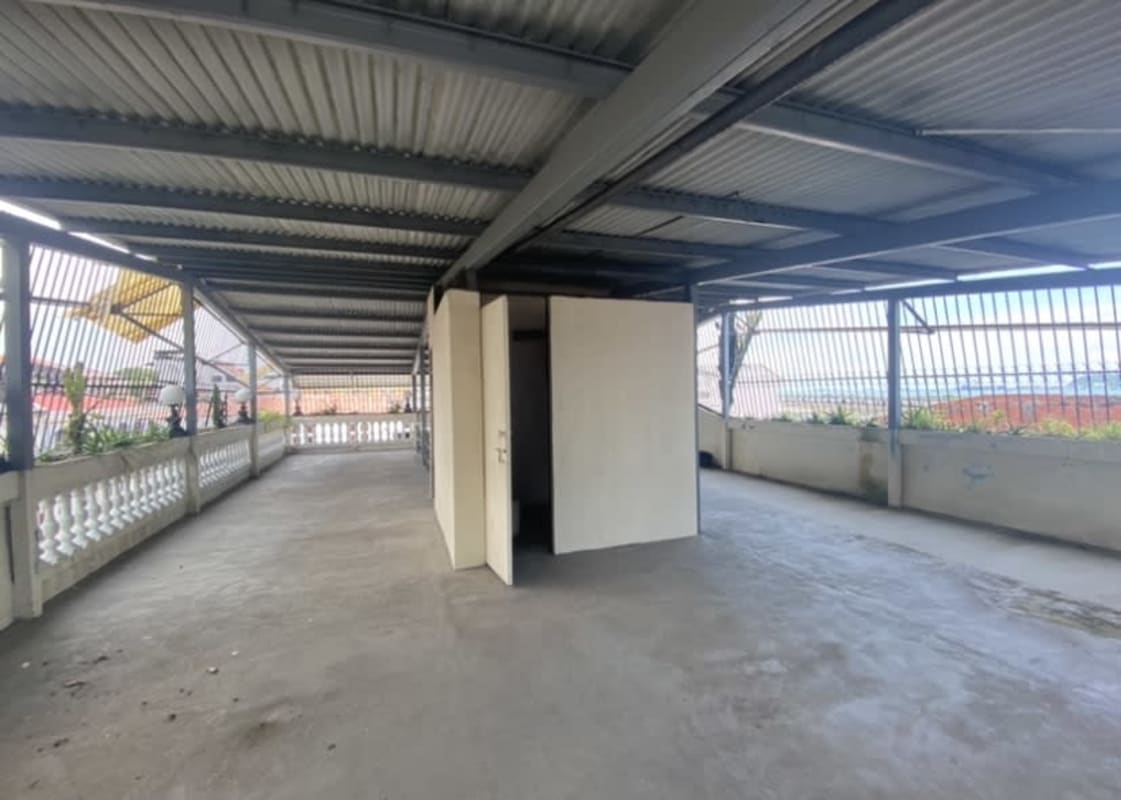 Empty high ceiling room with tiled floors in colonial building Casco Viejo Santa Ana Panama