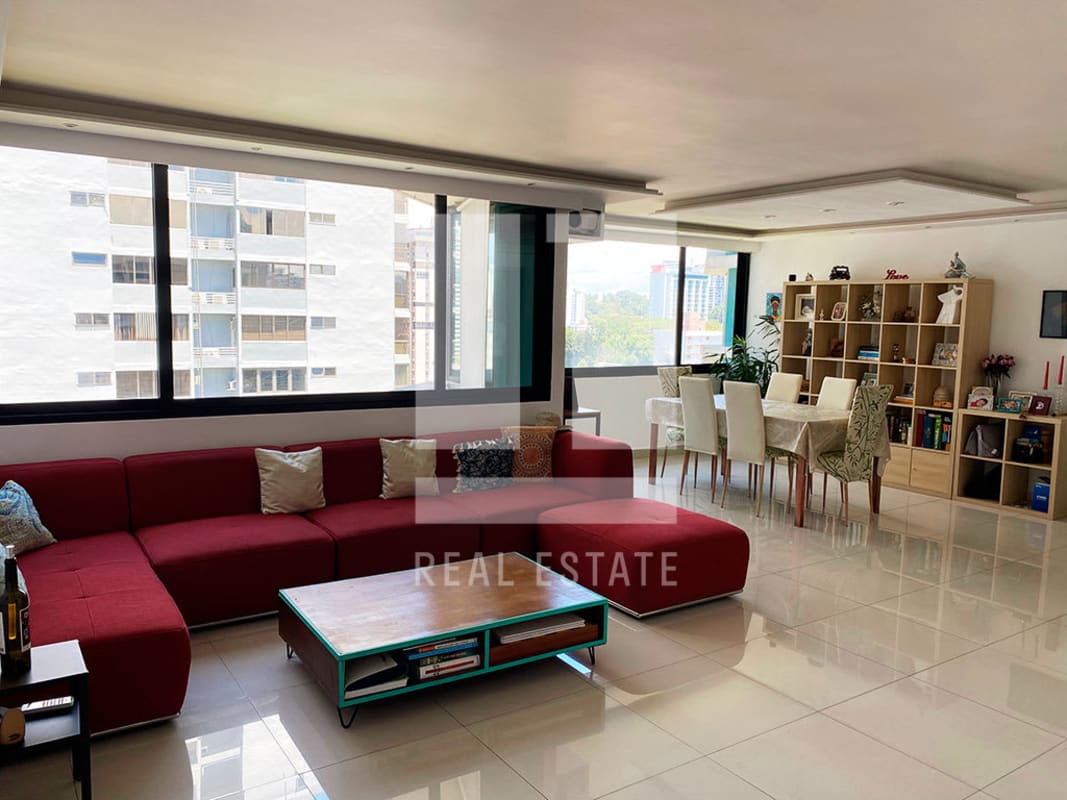Dining room with large window, tile floors, bookshelf and plenty natural light in PH Twin Towers Panama