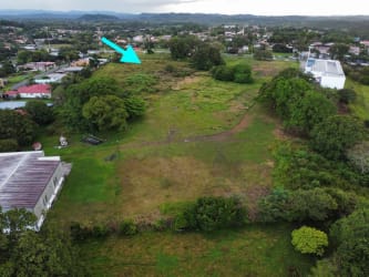 Aerial photo of commercial land with nearby trees, adjacent developments Santiago Panama