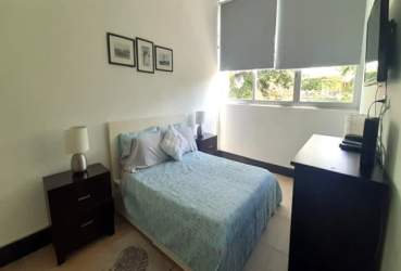 Master bedroom featuring ocean view balcony ensuite bath Riomar Resort Panama