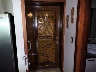 Decorative front door with sun design and stylish entry at Bahia Resort Nueva Gorgona Panama