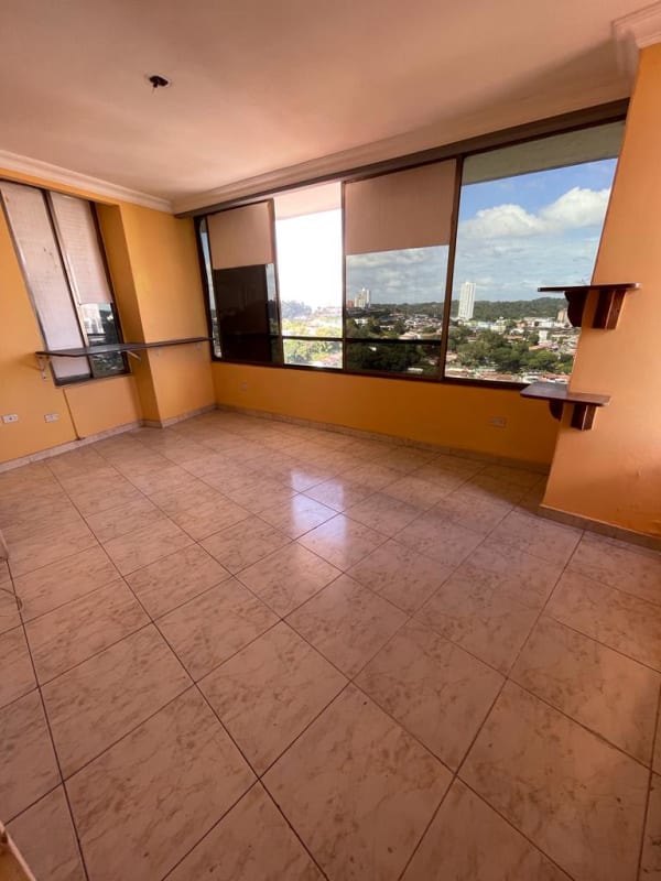 Large living room with tiled floor, big windows, city view PH Beverly Hills Betania