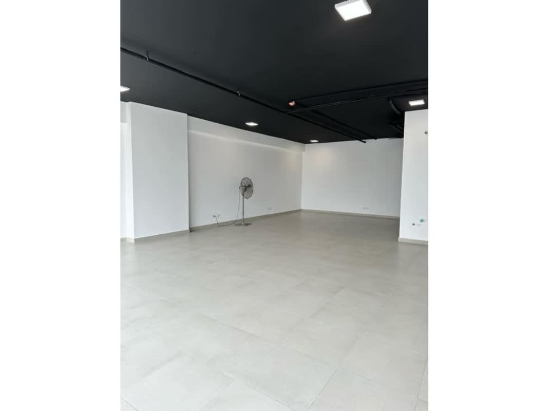 Open office area with black ceiling and recessed lighting in San Francisco Business District