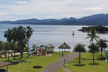Lakeside playground surrounded by palms at Playa Escondida Resort Colón Panama