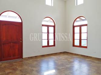 Large master bedroom with arched windows, mountain views, luxury finishes Panama