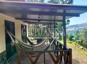 Rustic porch with hammocks overlooking mountain and forest at Altos del María