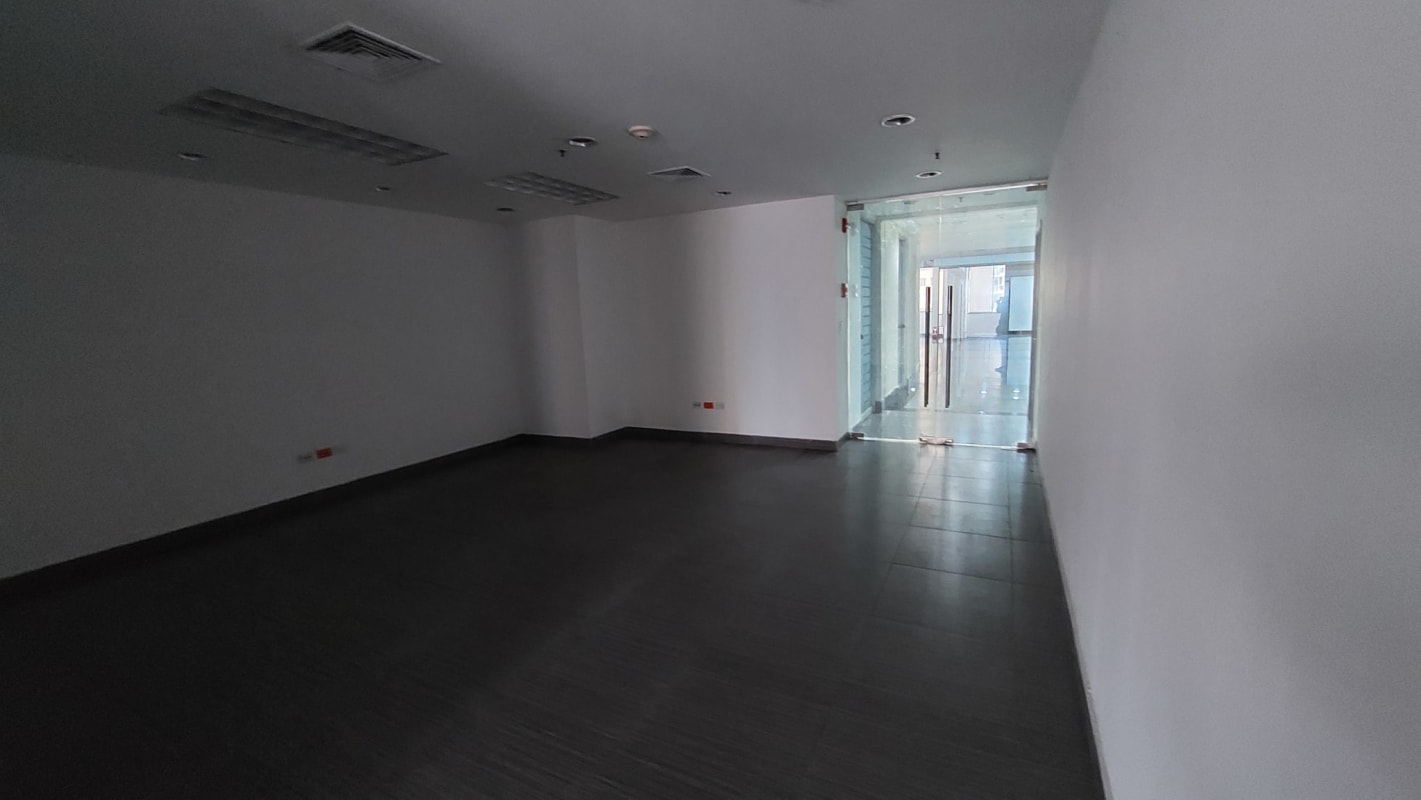 Entryway glass door to empty modern office space Torre de Las Americas Panama City