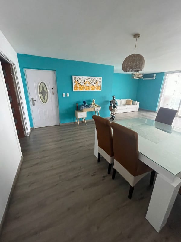 Spacious kitchen with granite counters and red cabinets at PH Crystal Panama