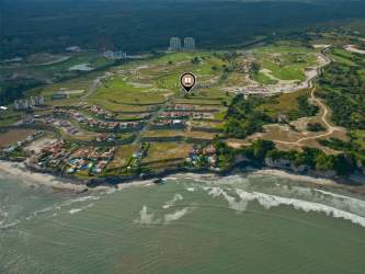 Coastal aerial view of beachfront and oceanfront villas in Vista Mar Golf Beach Resort Panama