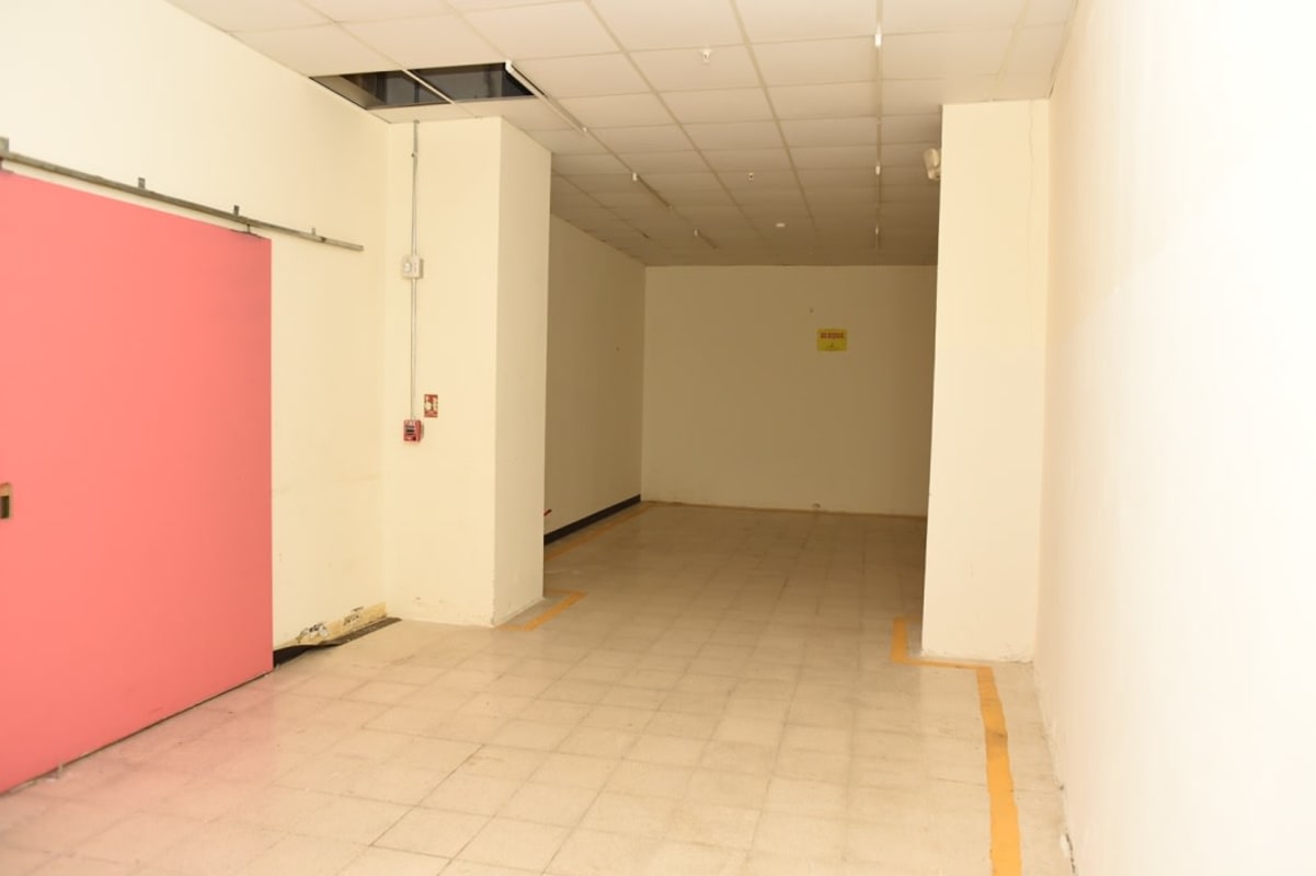 Illuminated commercial shopping plaza at night in El Cangrejo Panama