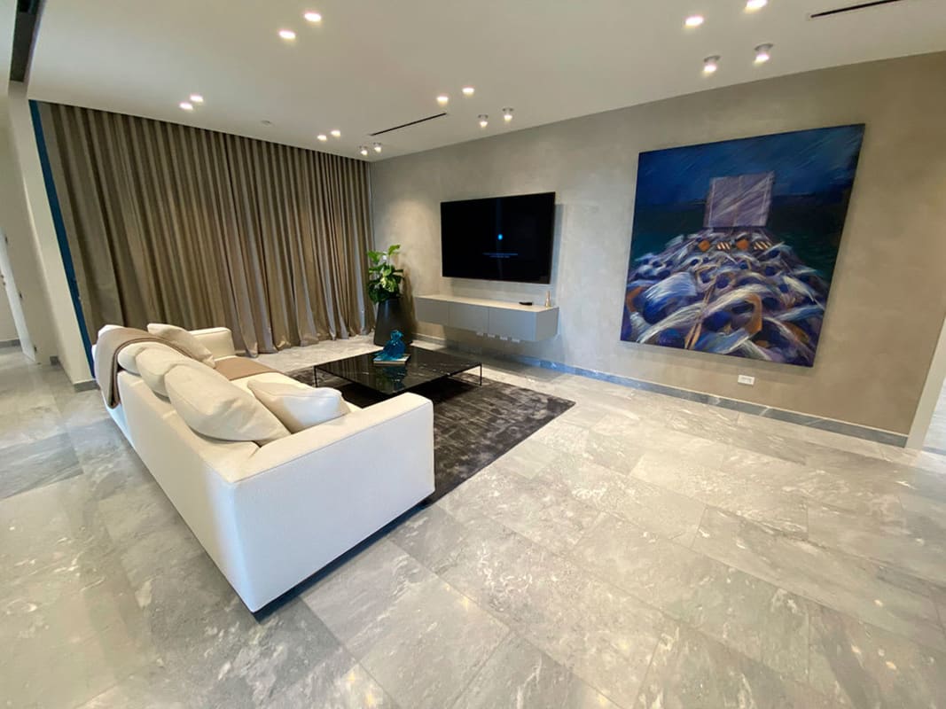 Designer open kitchen with island and integrated dining at Upper East Tower Costa del Este Panama