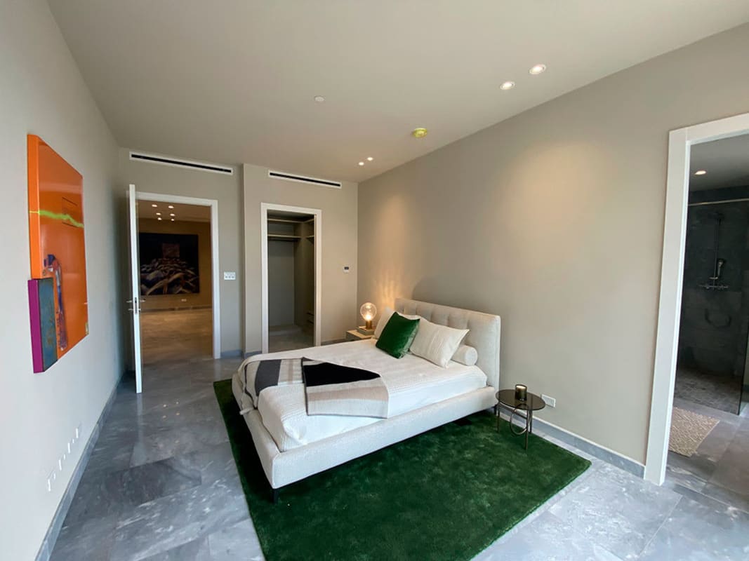 Modern guest bedroom with large windows, neutral decor Upper East Tower Costa del Este Panama