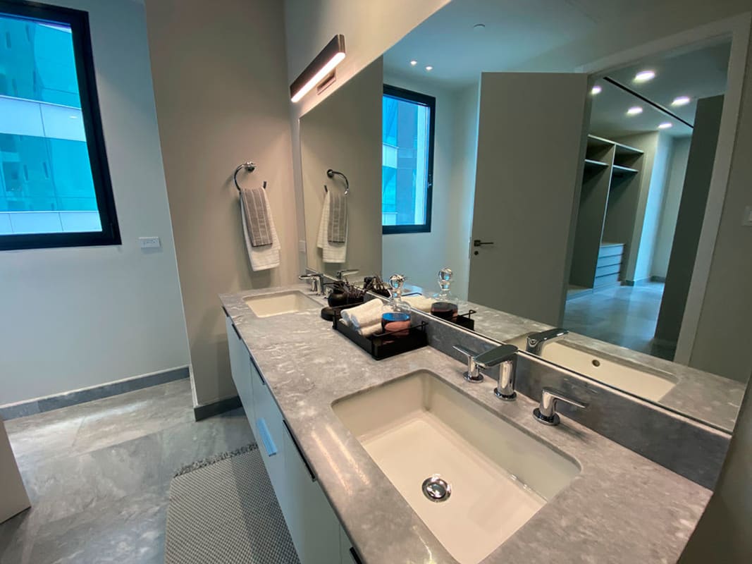 Bathroom with double vanity, premium finishes, walk-in shower in Upper East Costa del Este Panama apartment