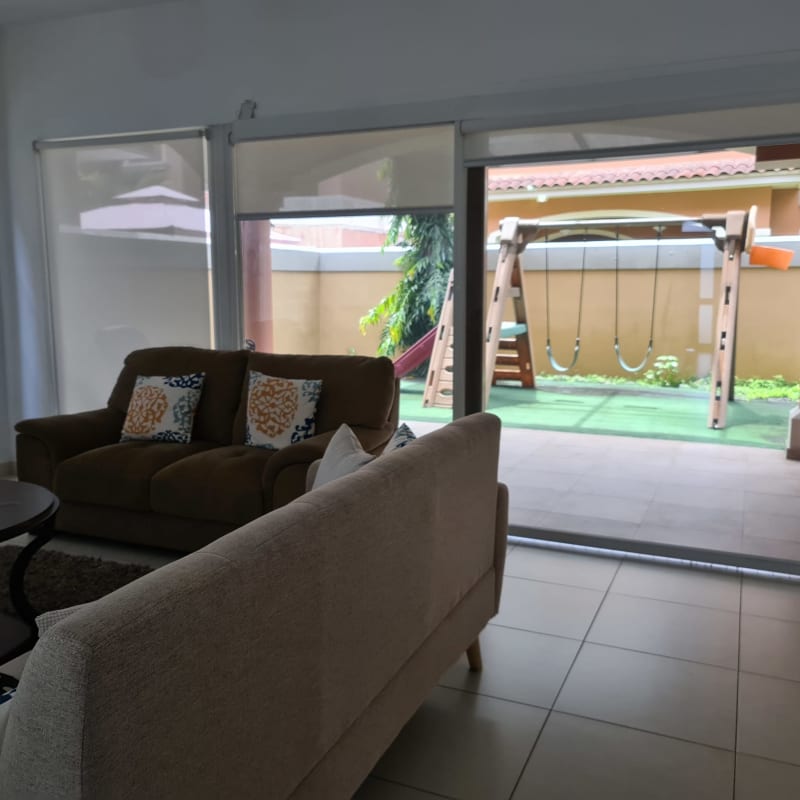 Living room with large sliding doors to terrace PH Doral Costa Sur Panama