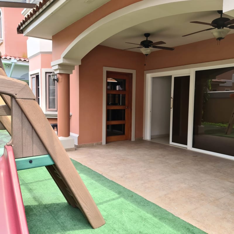 Covered terrace with ceiling fans and view of children's play area PH Doral Costa Sur