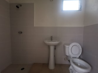 Bright small bedroom with tiled floor and window in remodeled affordable house in Arraiján Panama