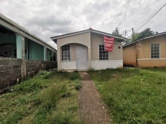 Front porch and façade of remodeled fenced house for sale in Altos del Tecal Arraiján Panama