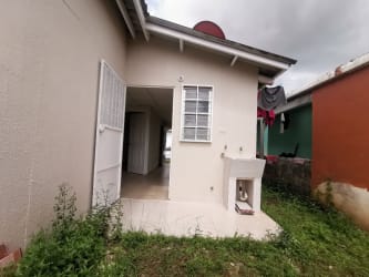 Outdoor laundry area and back porch of house in Altos del Tecal Panama for sale