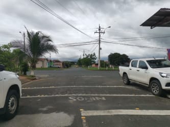 Side and backyard of single-story house with yard in Altos del Tecal Panama