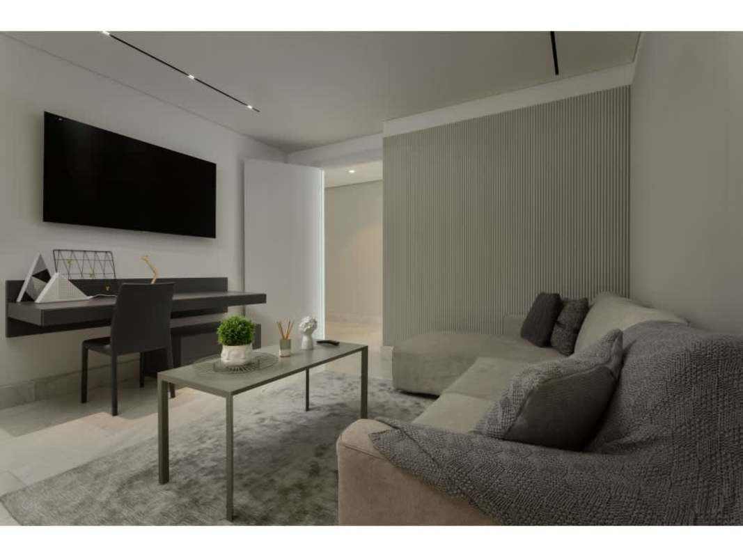 Luxury bathroom with double sink vanity, backlit mirrors and large walk-in closet at The Towers Punta Paitilla