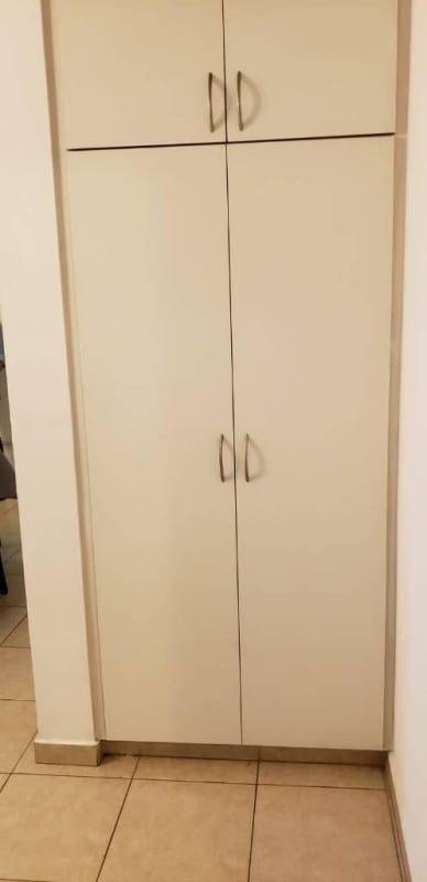 Functional kitchen with granite countertop appliances in El Cangrejo apartment Panama