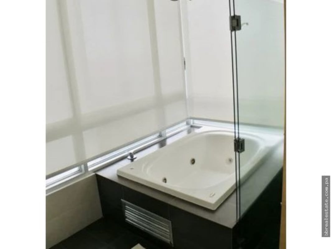 Bright gourmet kitchen black granite island window ocean view PH Altamar del Este Costa del Este Panama apartment sale