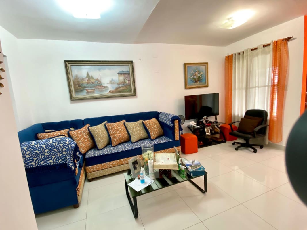 Spacious living and dining room with large windows and tile floors in Villa Zaita home Panama