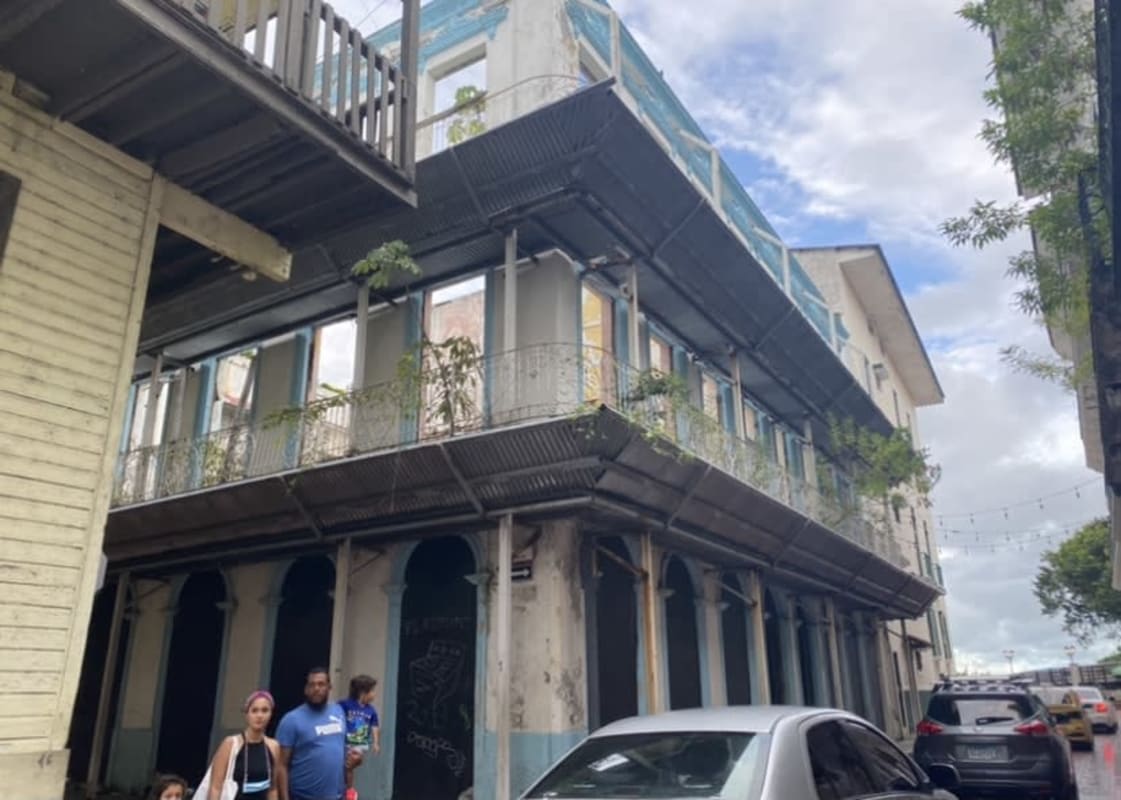 Corner colonial building in Casco Viejo with balconies and metal awnings for sale Panama City