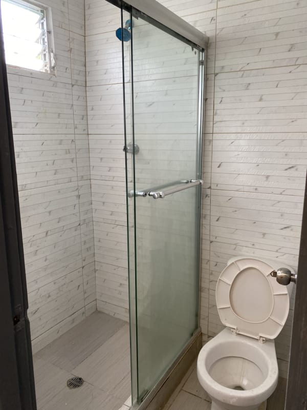 Modern bathroom with glass shower enclosure and vanity in Altos de San Angel Panama