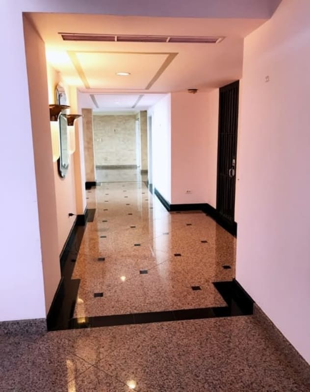 Modern hallway with terrazzo flooring and accent lighting penthouse PH Sobre Las Rocas Panama