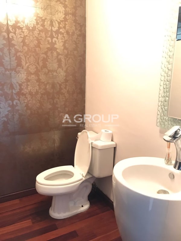 Closed kitchen with granite top, cabinets, and appliances in Punta Paitilla apartment Panama