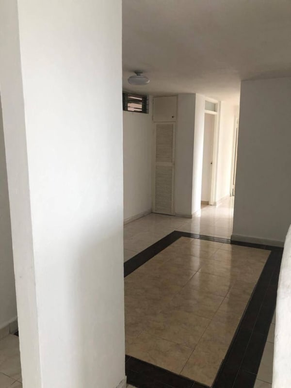 Spacious living room with tile floors and ceiling fans in PH Via Argentina Panama City